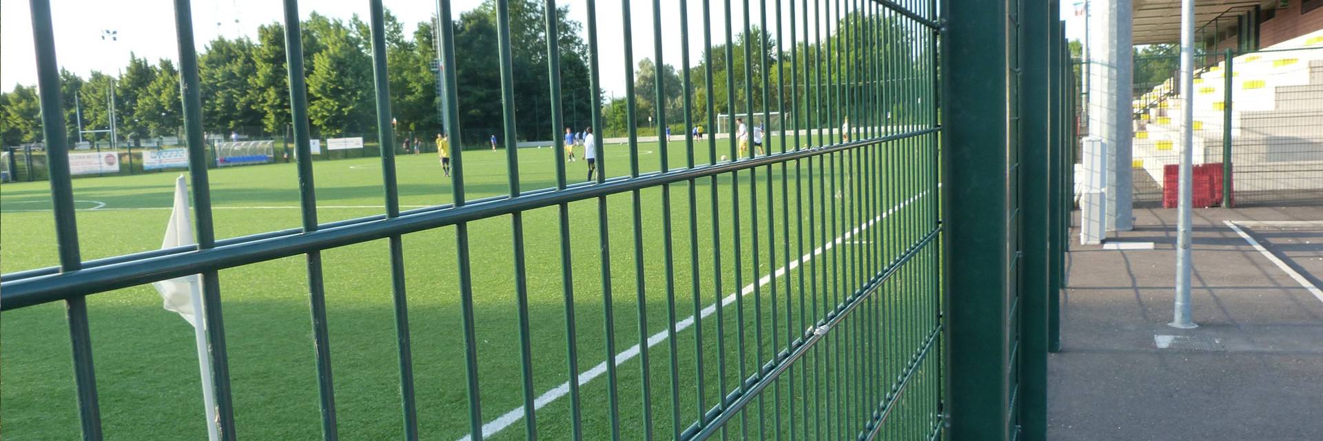 Green PVC coated double wire fence used as a fence for sports ground.