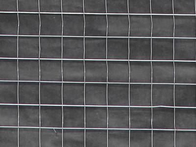 A part map of welded wire lath used on wall, with black water resistant paper behind the lath.